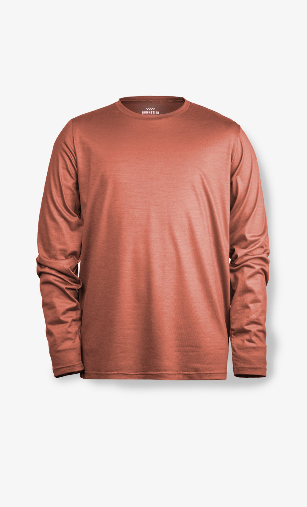 Chandail à manches longues en laine de mérinos Stretchwool orange brûlé pour homme, fabriqué au Canada.